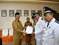 Bupati Rum Pagau Lantik Dua Penjabat Kepala Desa di Paguyaman